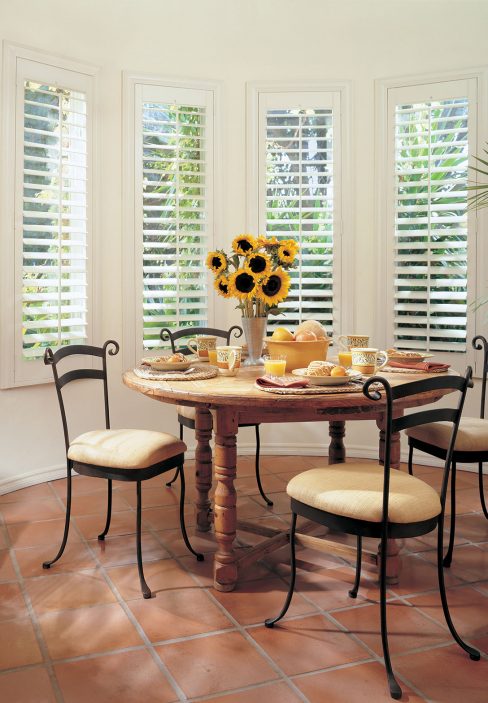 Eating Area with White Wooden Blinds and Sunflowers | Amy's Blinds on Marco Island, Florida